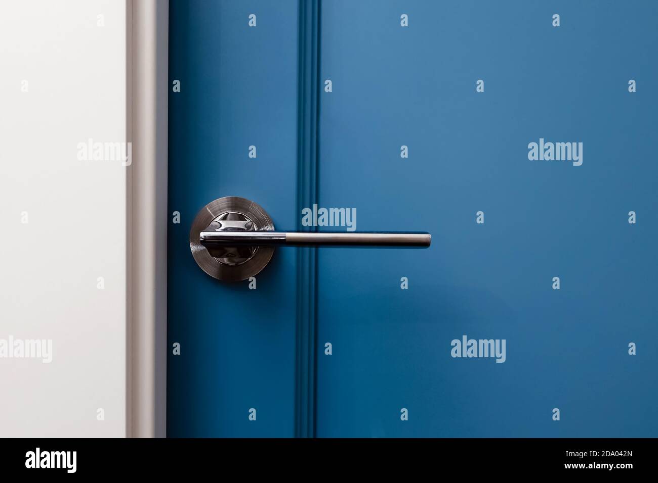 Blue colored door in modern design apartment Stock Photo