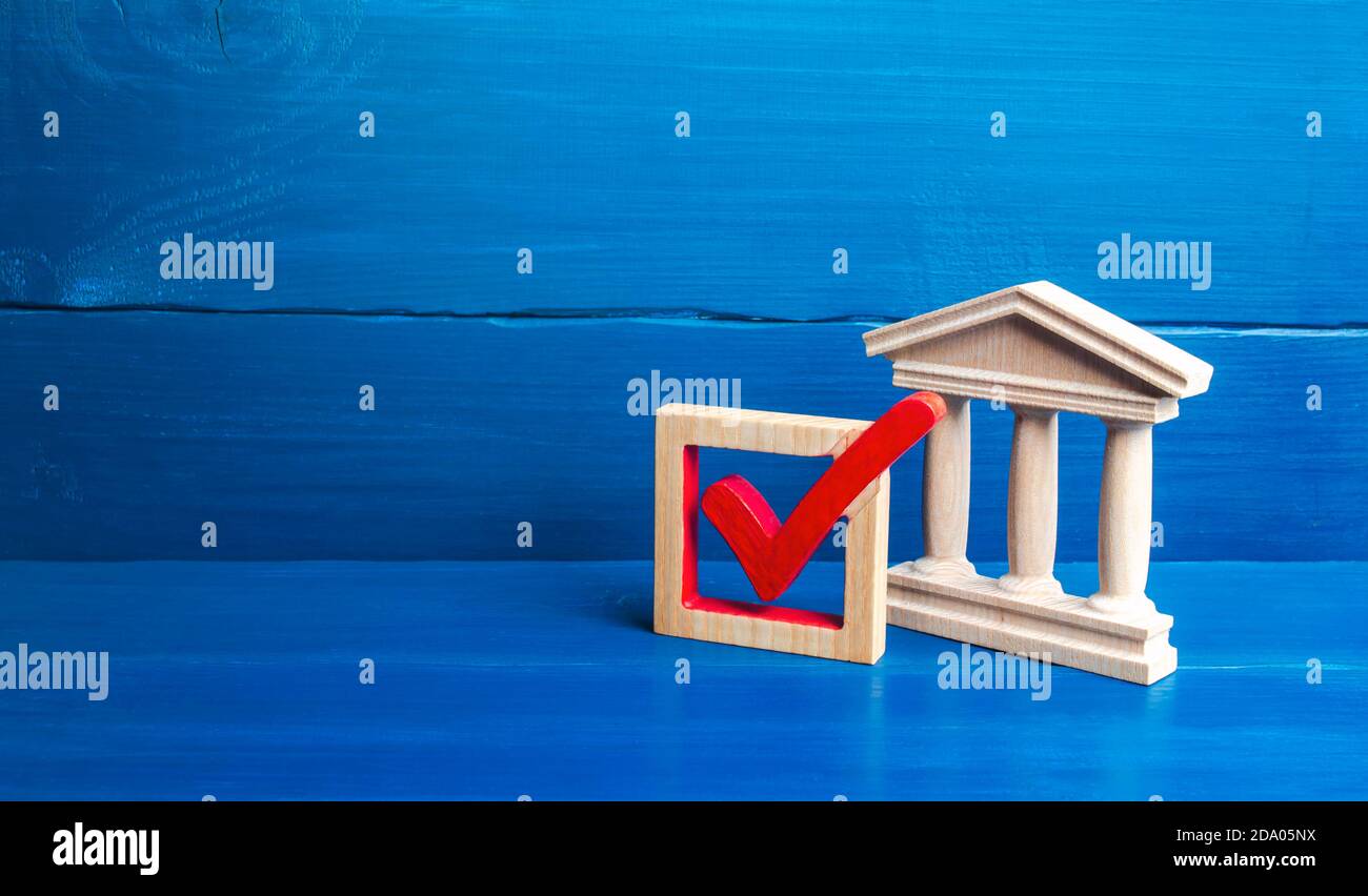 Government building and red check mark. Presidential or parliamental democratic elections, referendum. Social poll. Rights and freedoms. Government le Stock Photo