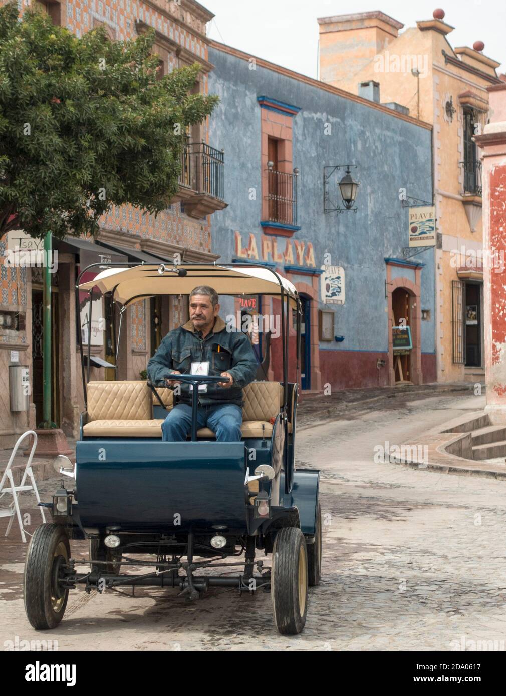 Vintage car being driven around Bernal, Queretaro, Mexico Stock Photo