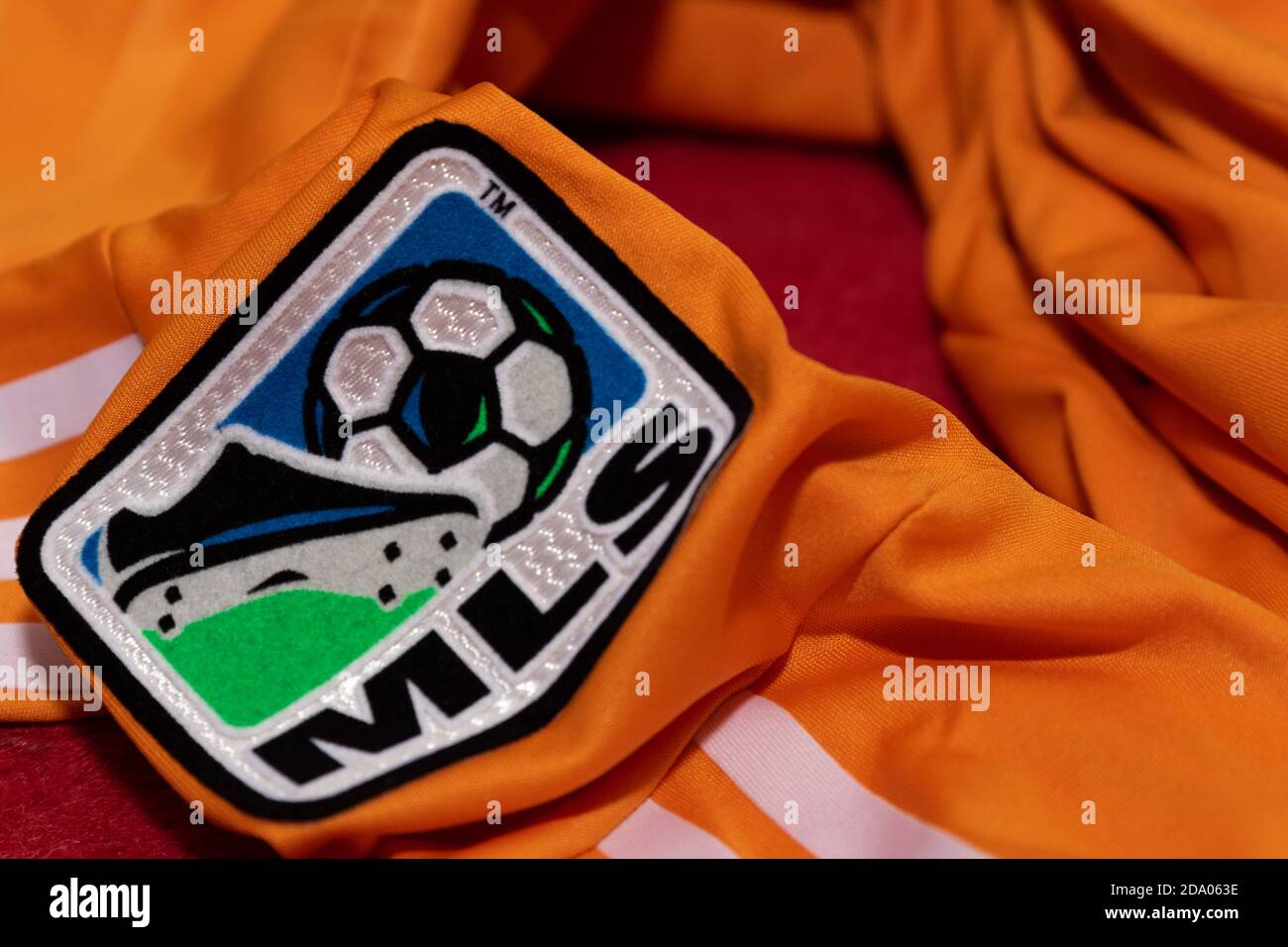MLS Major League Soccer badge on the arm of an orange Houston Dynamo Football Shirt Stock Photo
