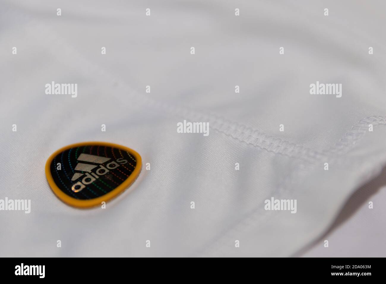 Small Adidas Mountain Logo on a football shirts Stock Photo - Alamy