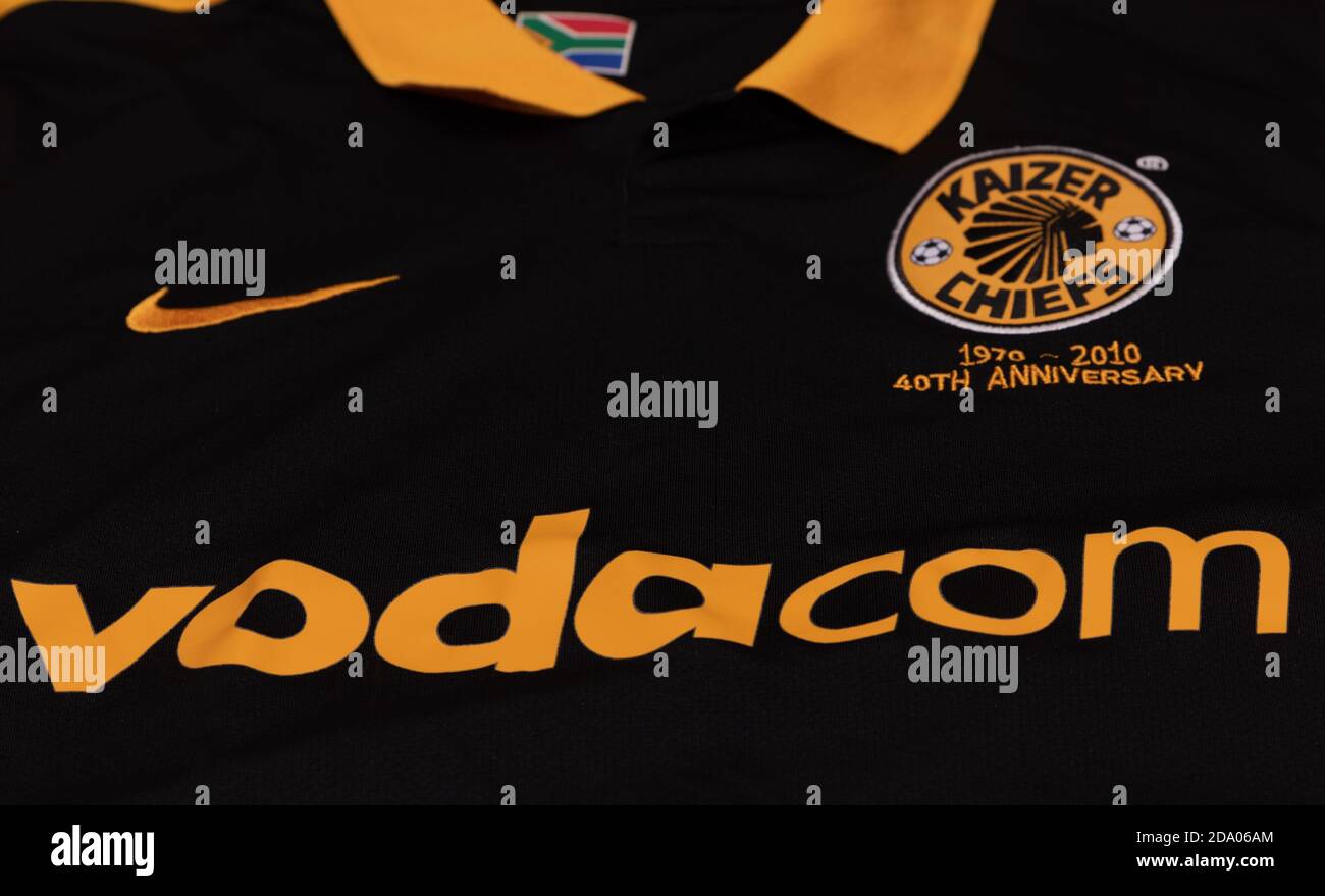 Sponsors on the front of a Kaizer Chiefs 40th Anniversary football shirt Stock Photo