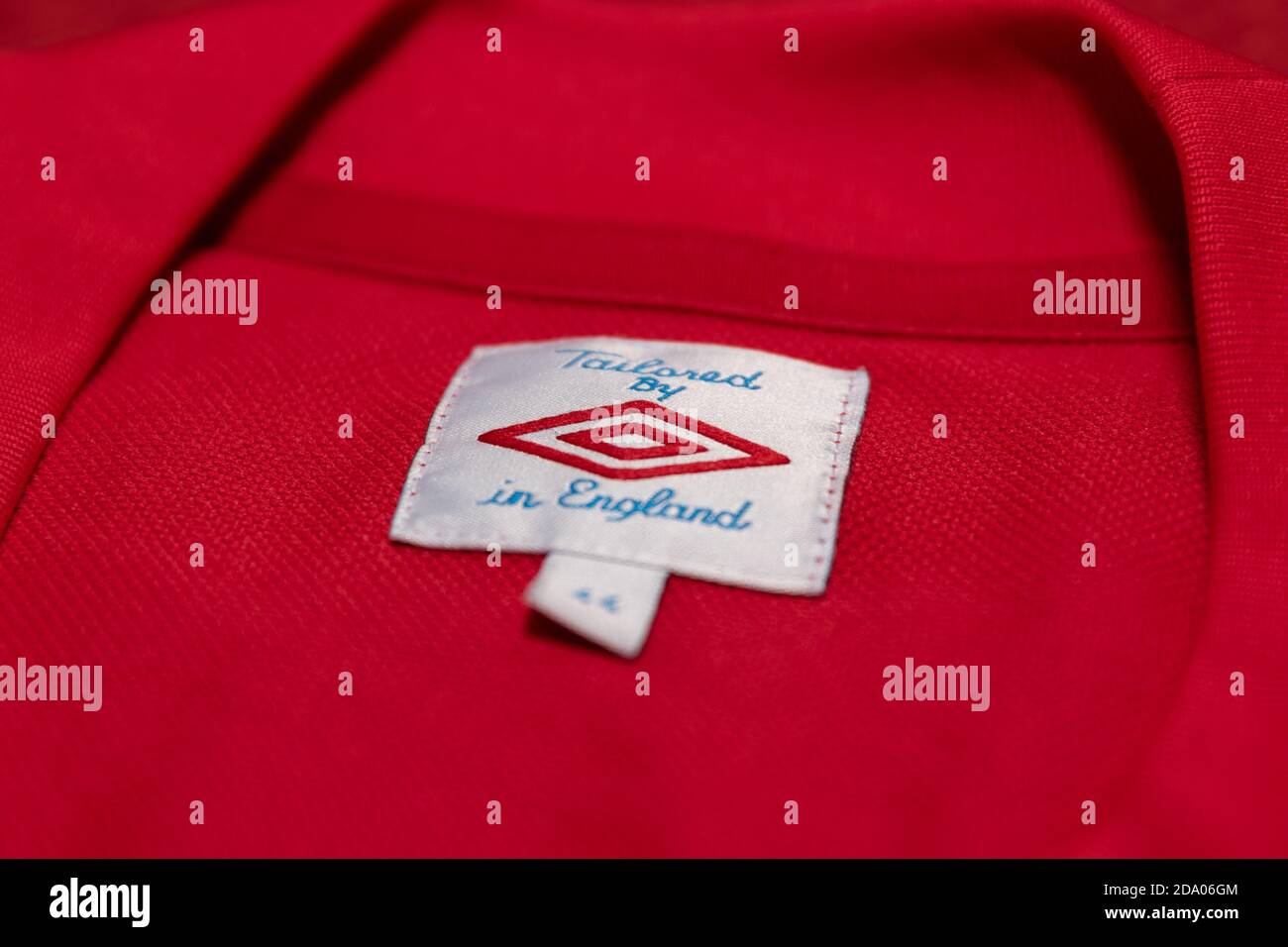 Tailored By Umbro in England label in the back of a red England Football  Shirt Stock Photo - Alamy