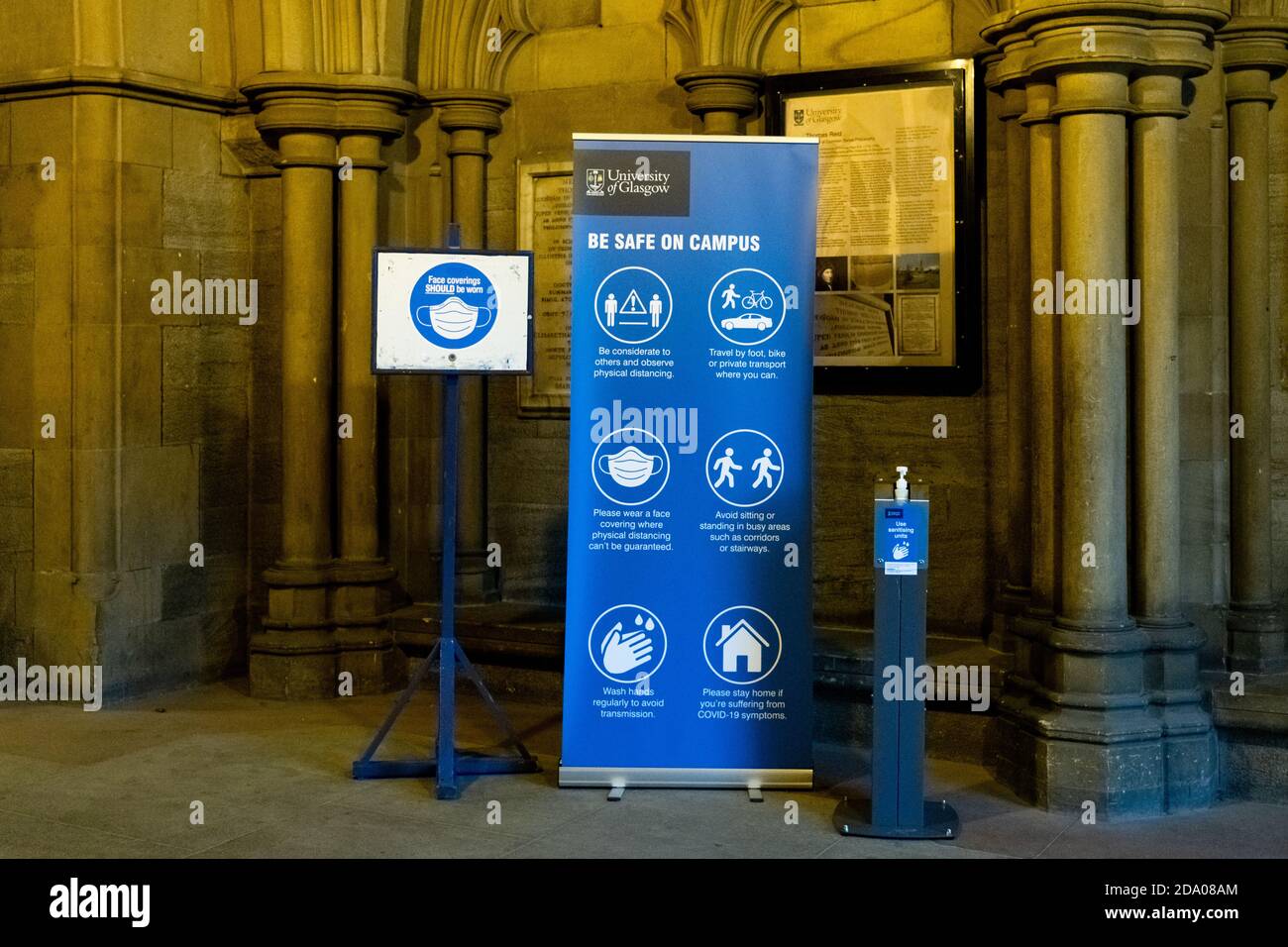 Be safe on campus signs and hand sanitiser at Glasgow University during