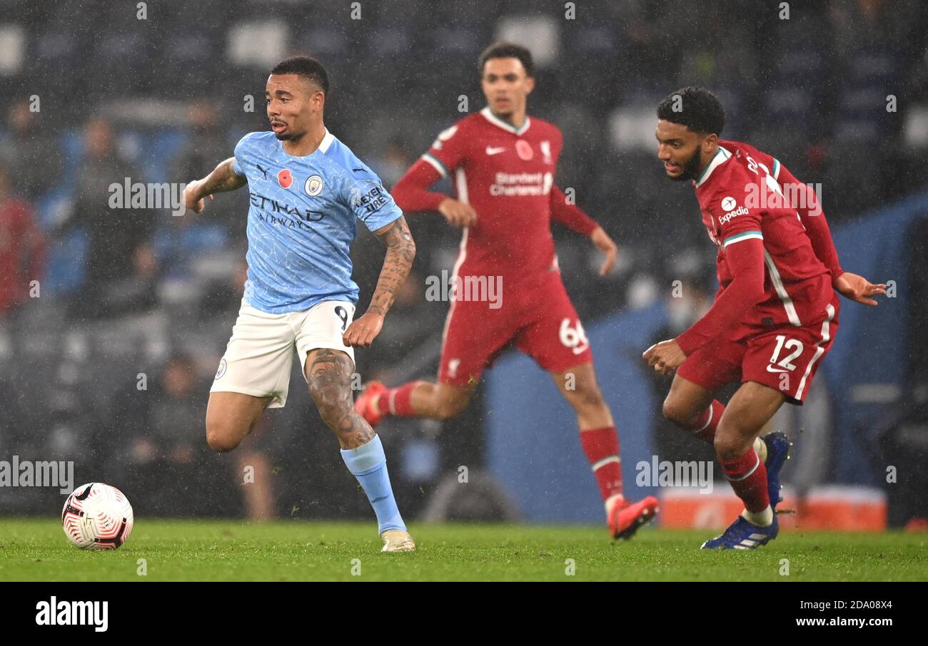 Manchester City's Gabriel Jesus (left) and Liverpool's Joe Gomez battle for the ball during the Premier League match at the Etihad Stadium, Manchester. Stock Photo