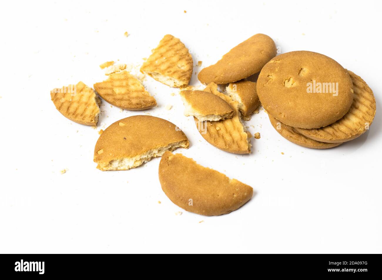 Scattered broken biscuits isolated on white background Stock Photo Alamy