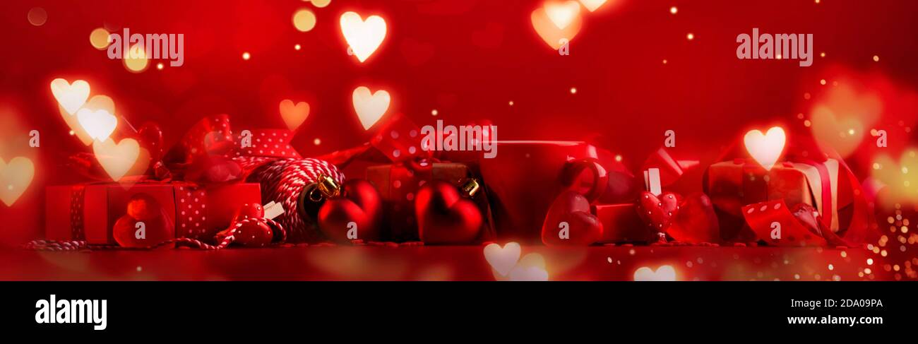 Valentine Day Red Banner Background with red hearts, gifts and ribbons ...