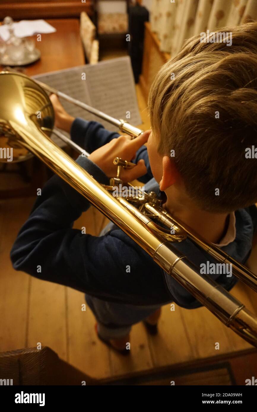 Boy playing trombone Stock Photo Alamy