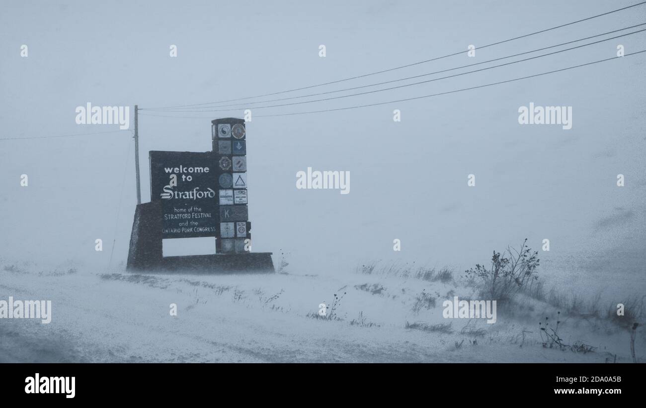 A view of the entrance to the City of Stratford, Ontario, during a winter stormy day. We can also read on the sign 'Pork Congress'.. Stock Photo