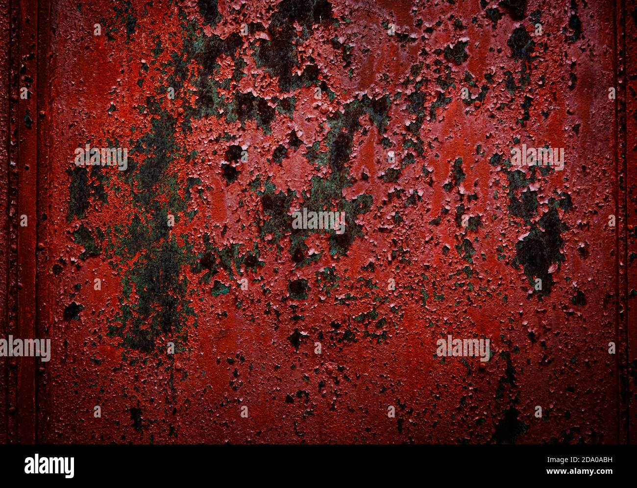 Iron texture or background with rusty peeling red paint. High contrast ...