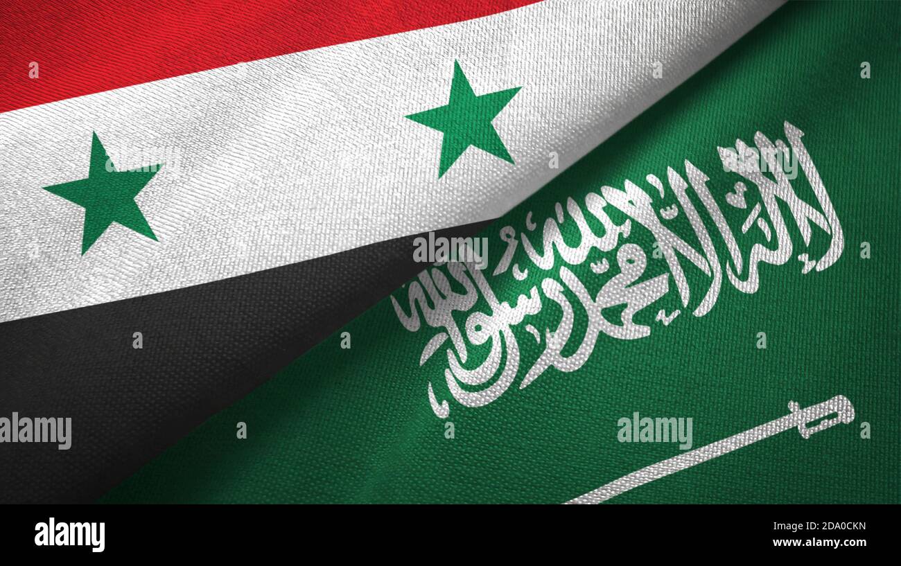 Syria and Saudi Arabia flags textile cloth Stock Photo