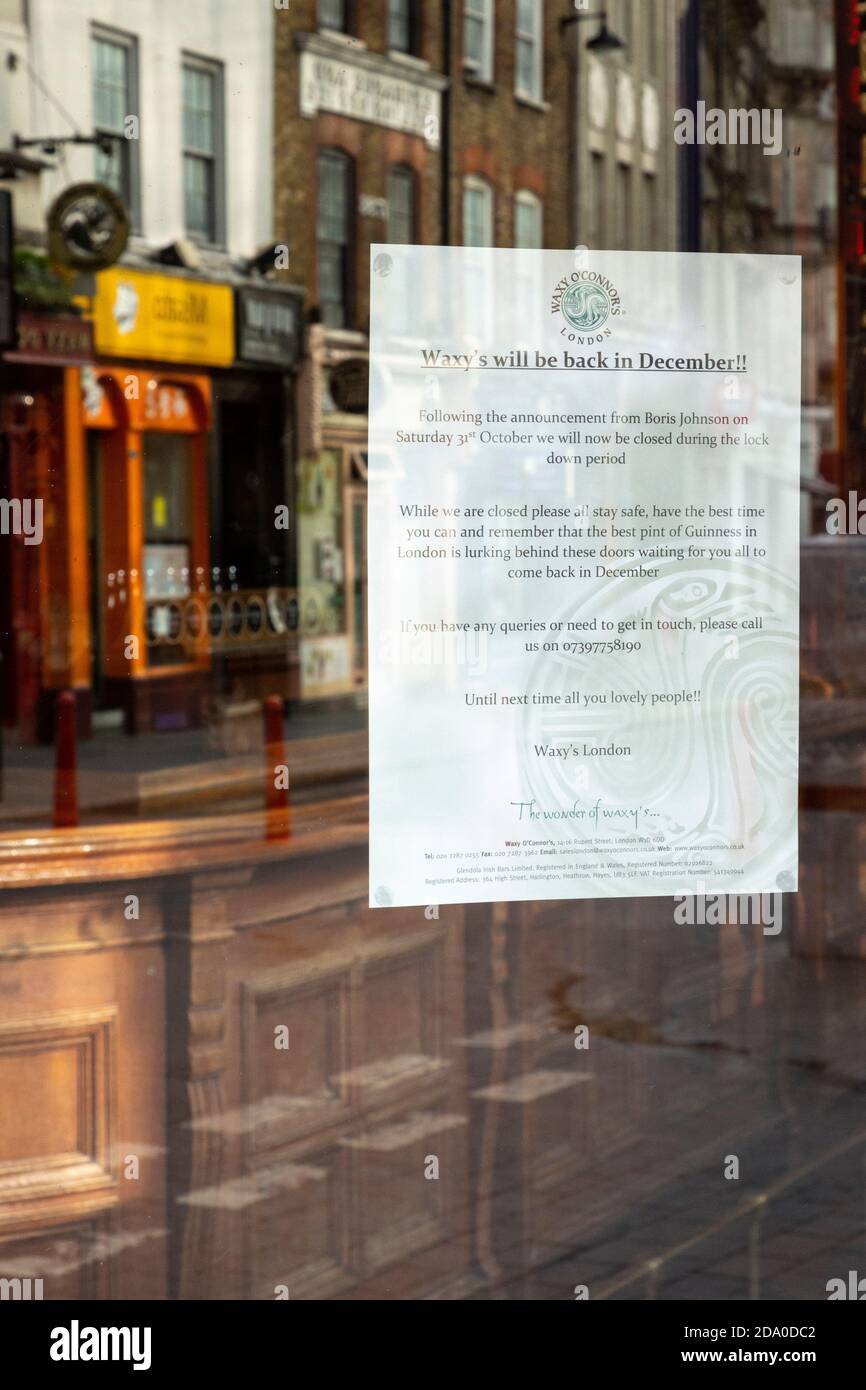 Notice sign on window of Waxy O'Connor's pub, closed during second national lockdown, London, 7 November 2020 Stock Photo
