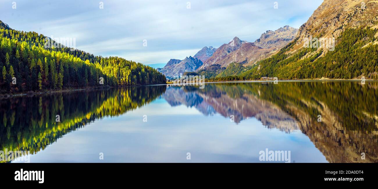 Mountain lake panorama with mountains reflection. Idyllic look. Autumn forest. Silvaplana Lake, Switzerland Stock Photo
