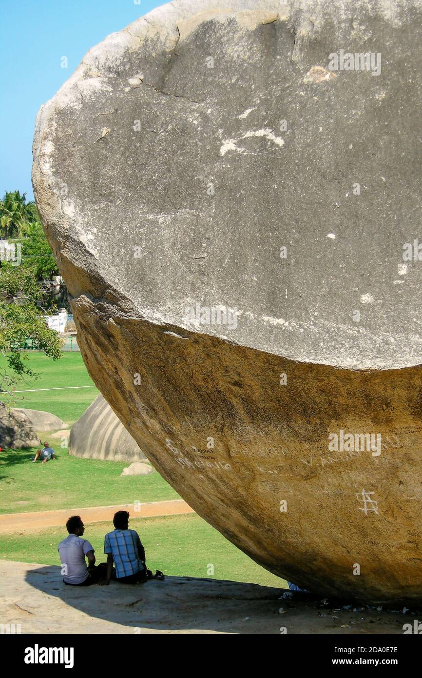 Mamallapuram, India. Couple under the so called Krishna's Butter Ball. Stock Photo