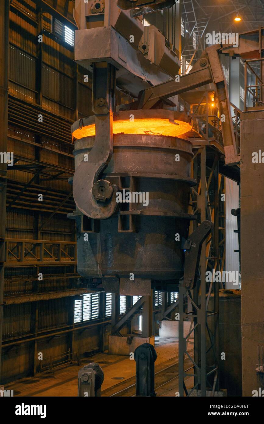 Steel production in electric furnaces. Sparks of molten steel. Electric arc furnace shop