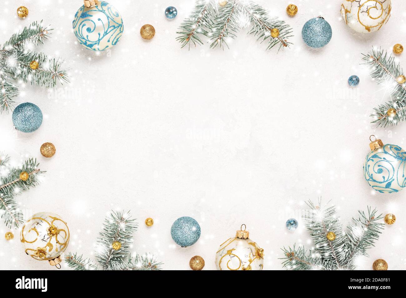 Christmas frame. Snowy white background. Gold, blue New Year decorations,  Copy space, winter holiday border Stock Photo - Alamy