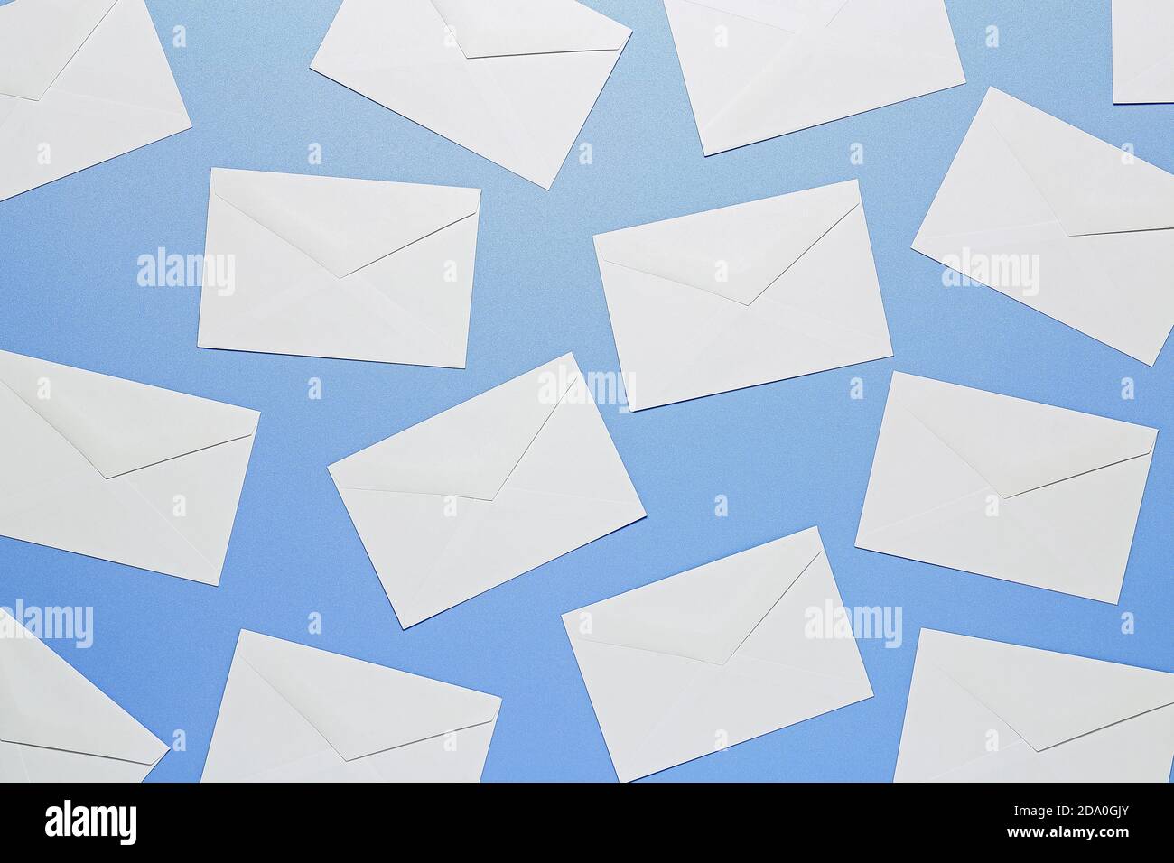 flat lay of white envelopes on blue surface Stock Photo