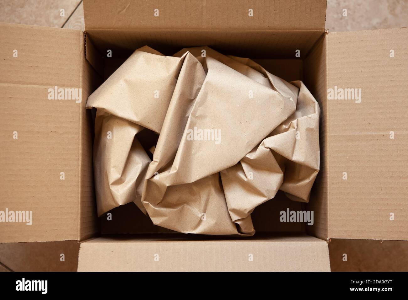 Paper Overrun Crumpled wrapping craft brown paper in open after delivery paperboard ...