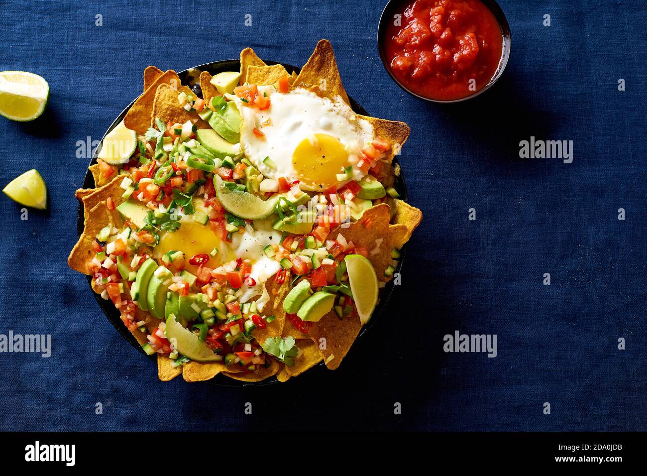 Chilaquiles mexican breakfast made of black beans, corn, tortilla chips