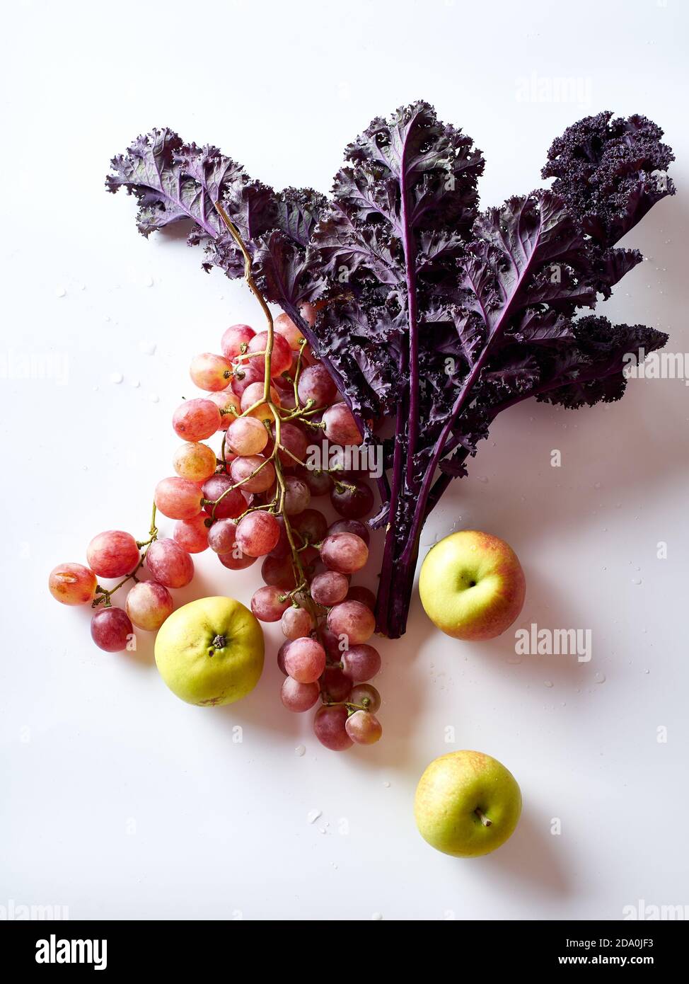 Flatlay with grapes, kale and apples Stock Photo