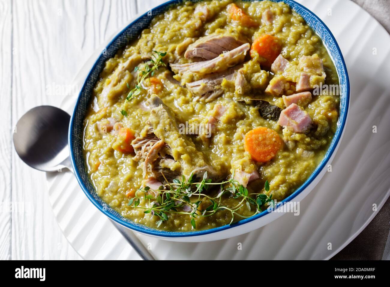 close-up of green peas finnish soup with pork ribs and ham in a bowl, horizontal view from above Stock Photo