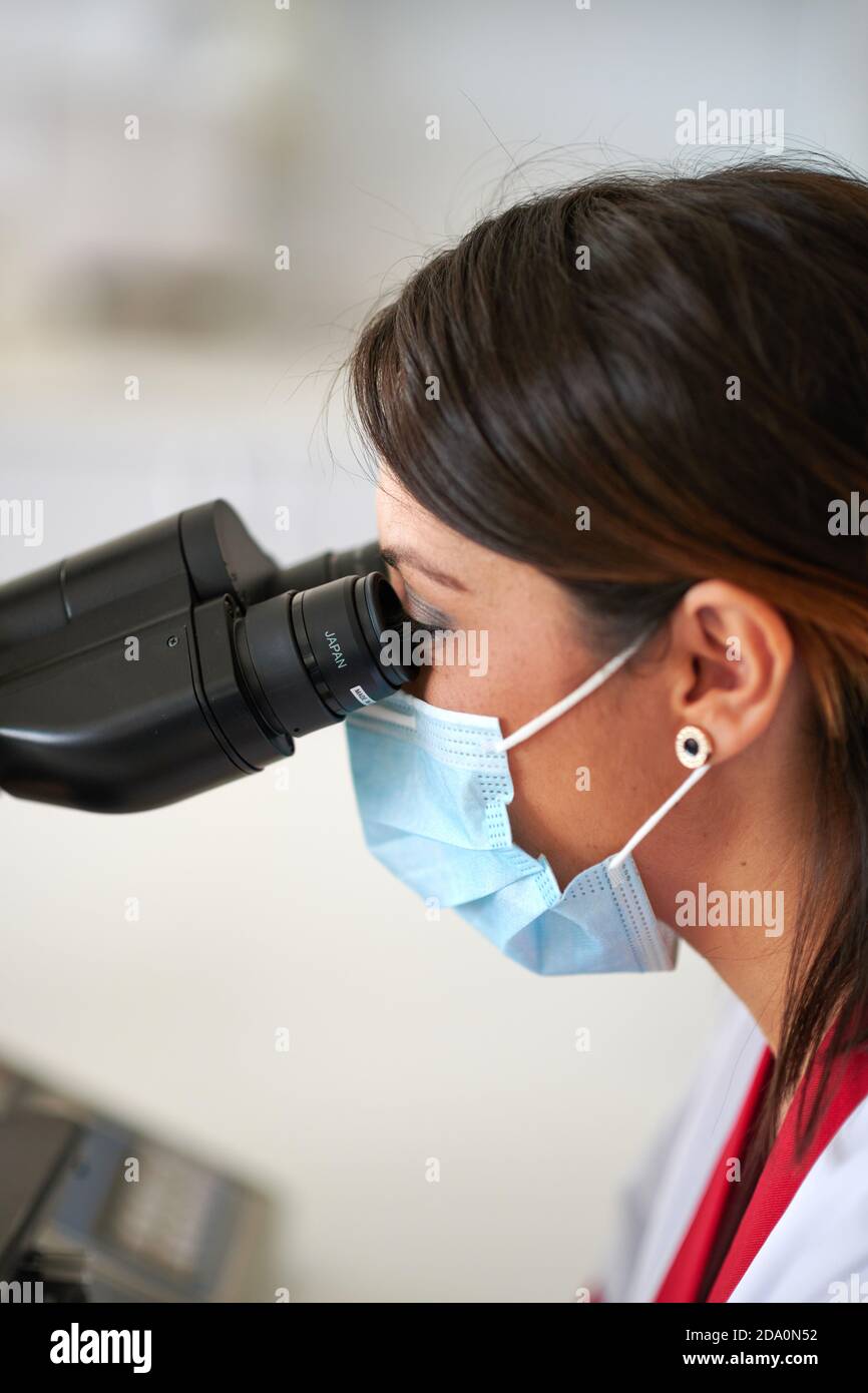 Hands of unrecognizable medic checking the eye of the boxer on boxing