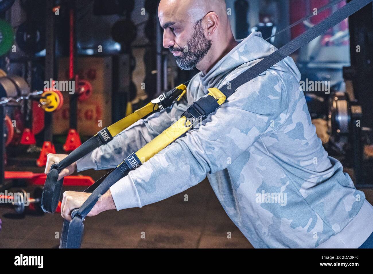Man Does Crossfit exercise With Trx Fitness Straps In Gym Stock Photo ...