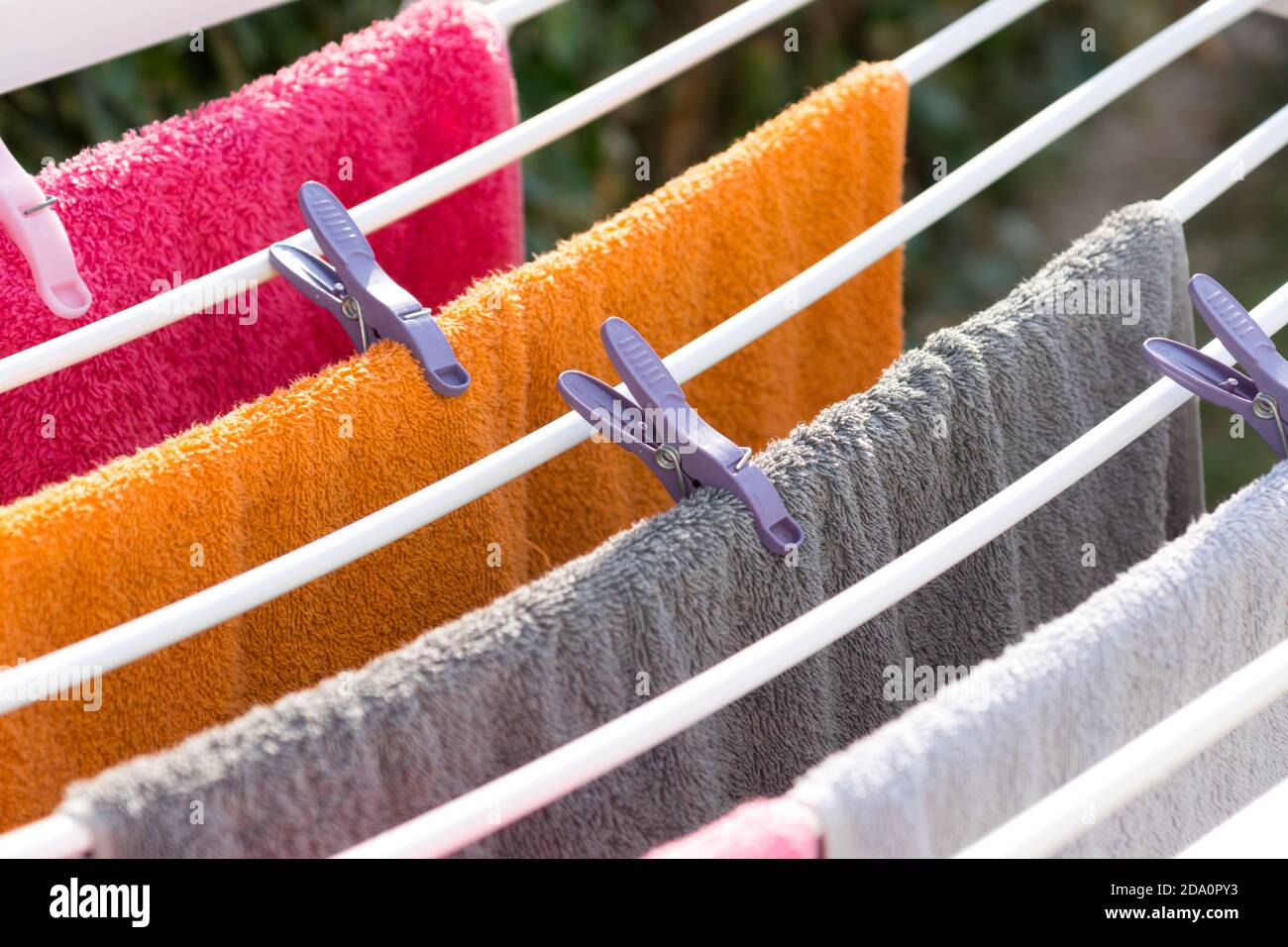 Clothes peg and freshly washed towels Stock Photo Alamy