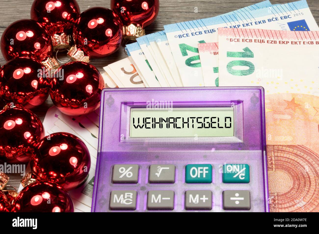 Christmas bonus and a calculator Stock Photo - Alamy