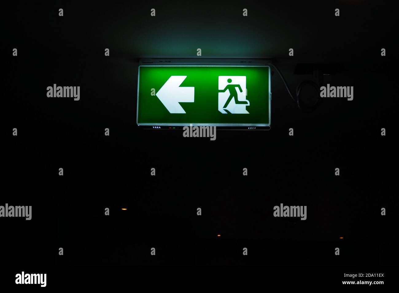 Emergency exit sign hanging on ceiling Stock Photo Alamy