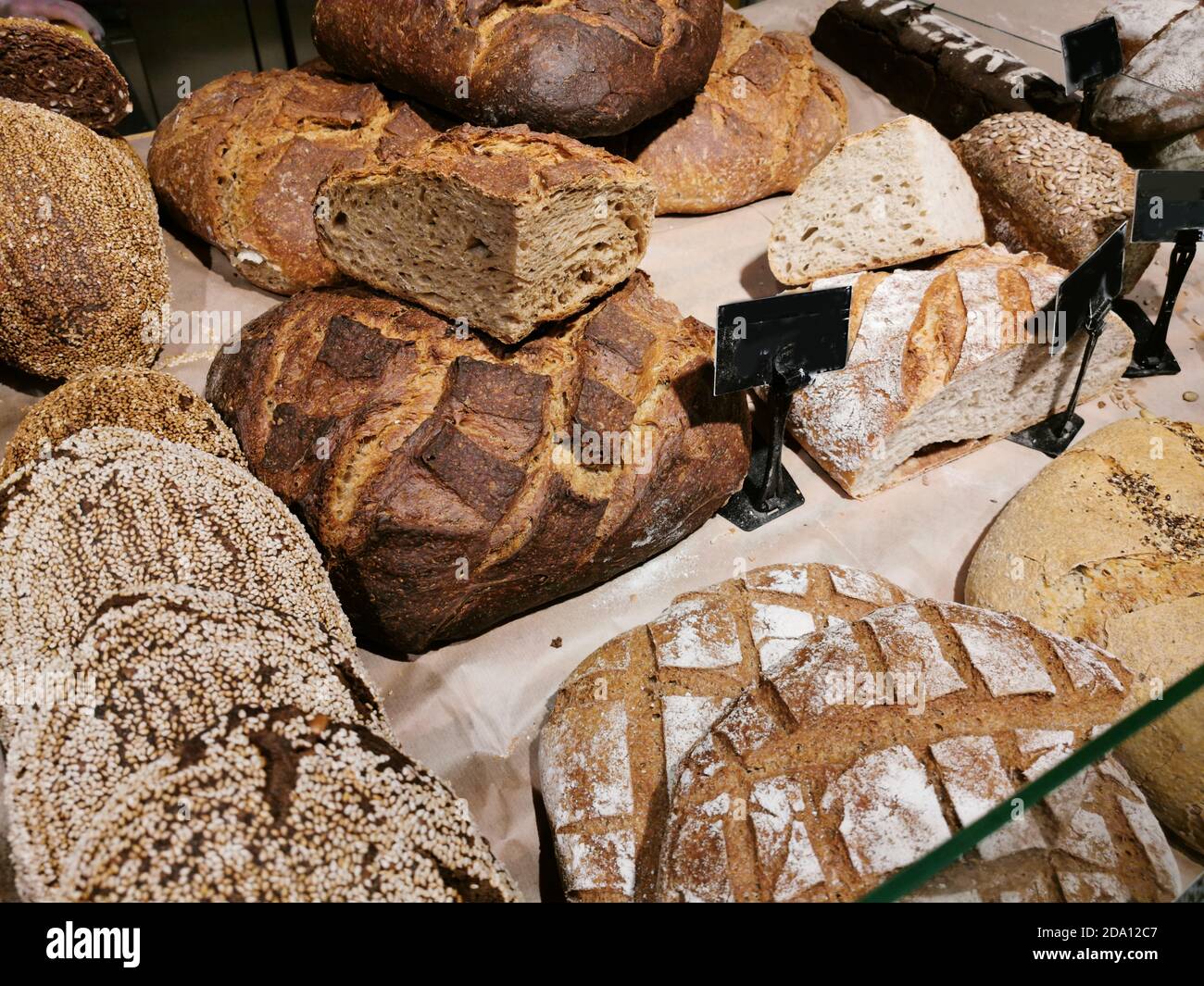Modern bakery with different kinds of bread, cakes and buns Stock Photo