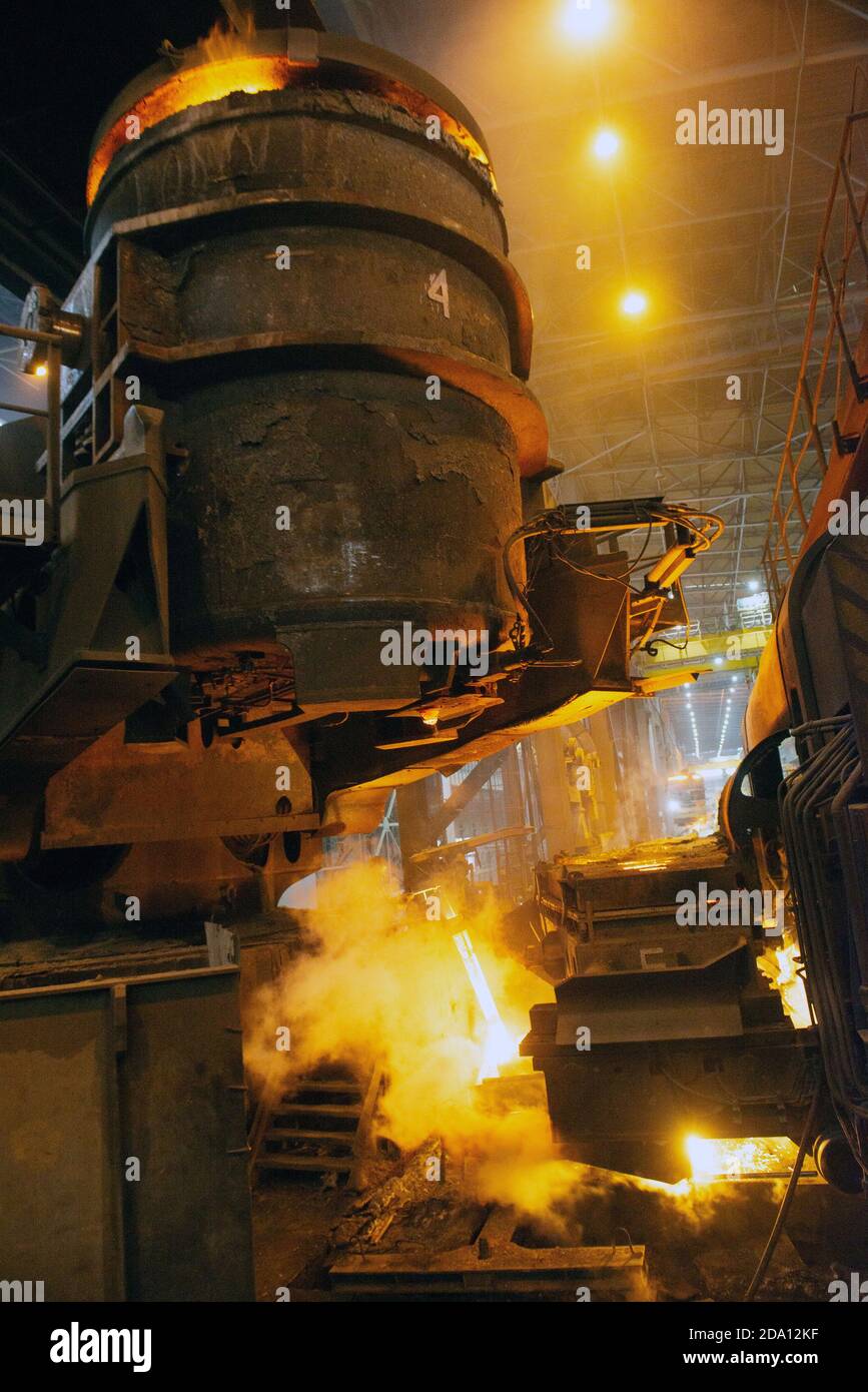 Steel production in electric furnaces. Sparks of molten steel. Electric ...