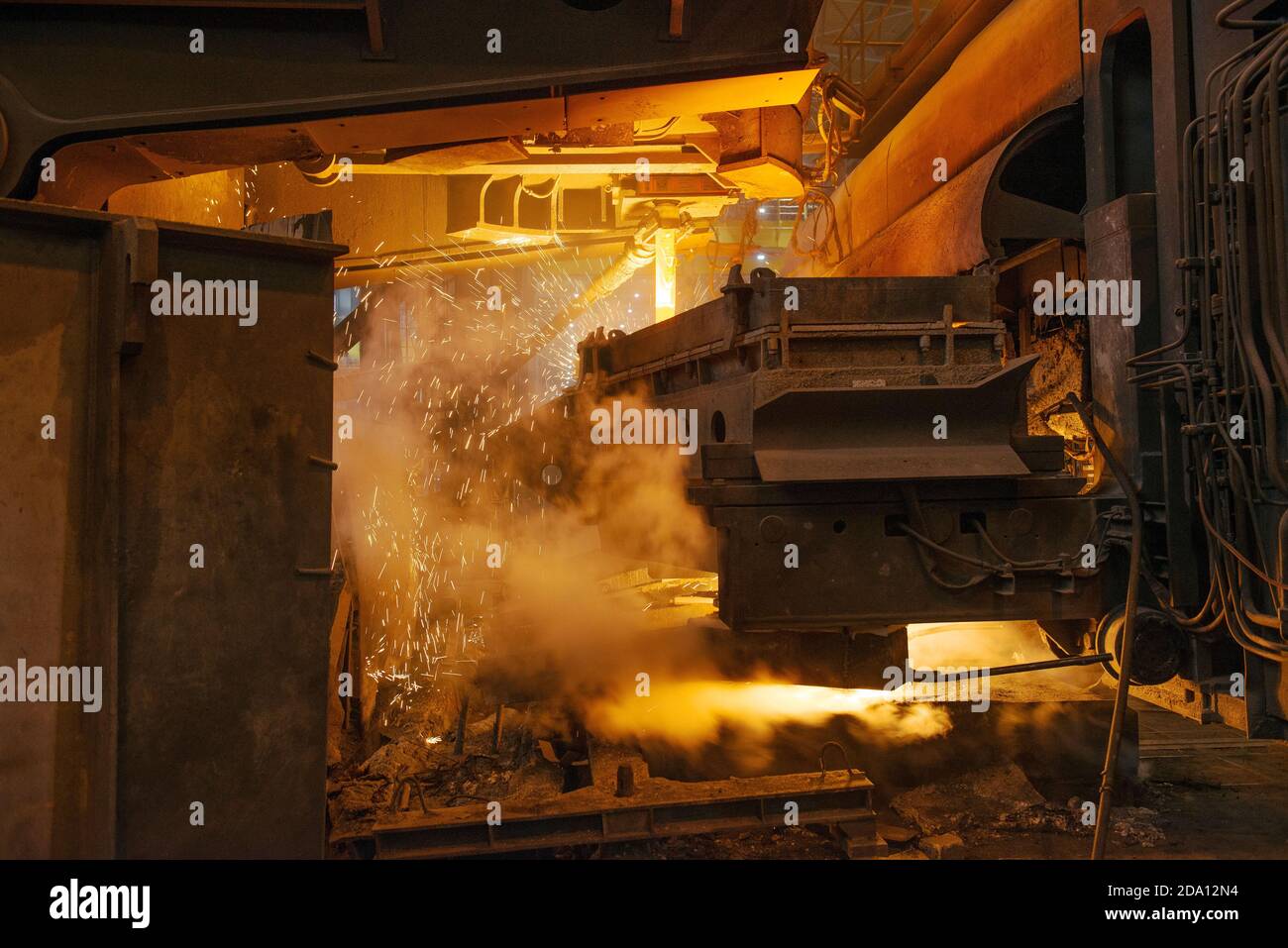 Steel production in electric furnaces. Sparks of molten steel. Electric