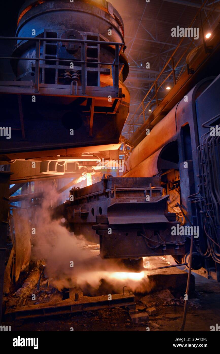 Steel production in electric furnaces. Sparks of molten steel. Electric ...