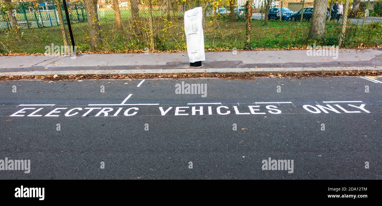 Electric vehicles only parking space on roadside next to newly