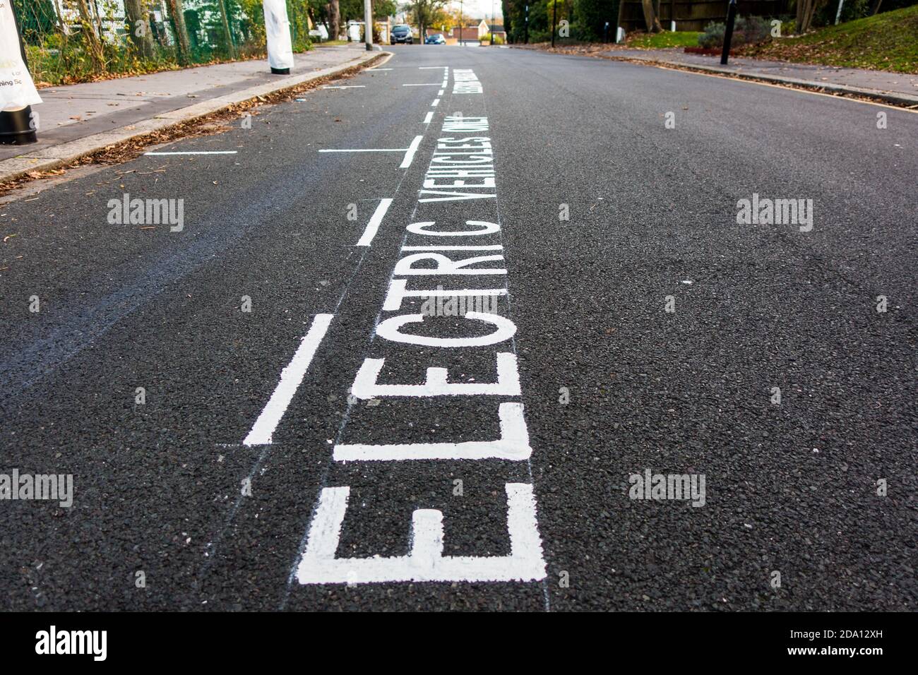 Electric vehicles only parking space on roadside next to newly