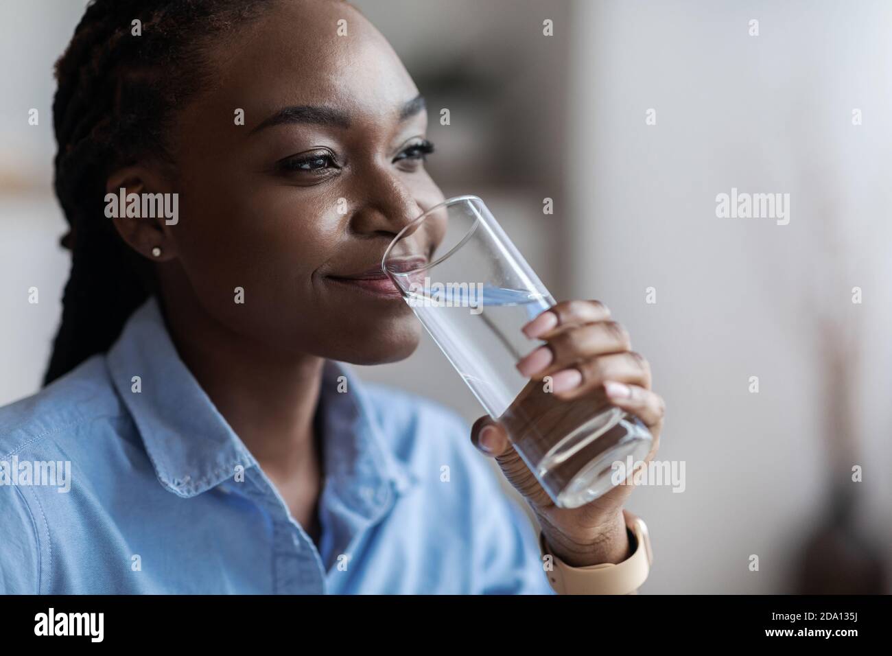african woman drinking water