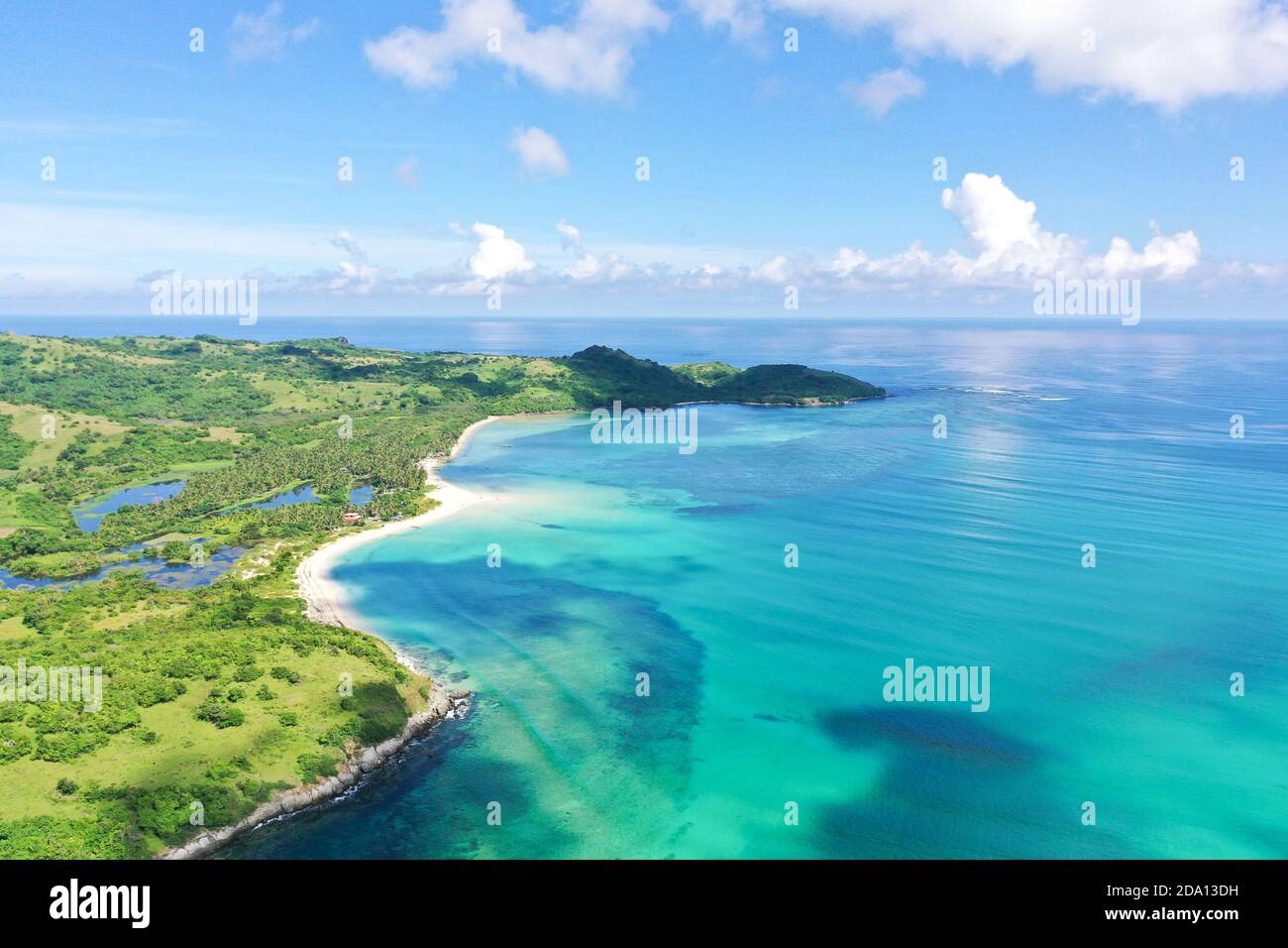 A tropical island with a turquoise lagoon and a sandbank. Caramoan Islands, Philippines. Beautiful islands, view from above. Summer and travel vacation concept. Stock Photo