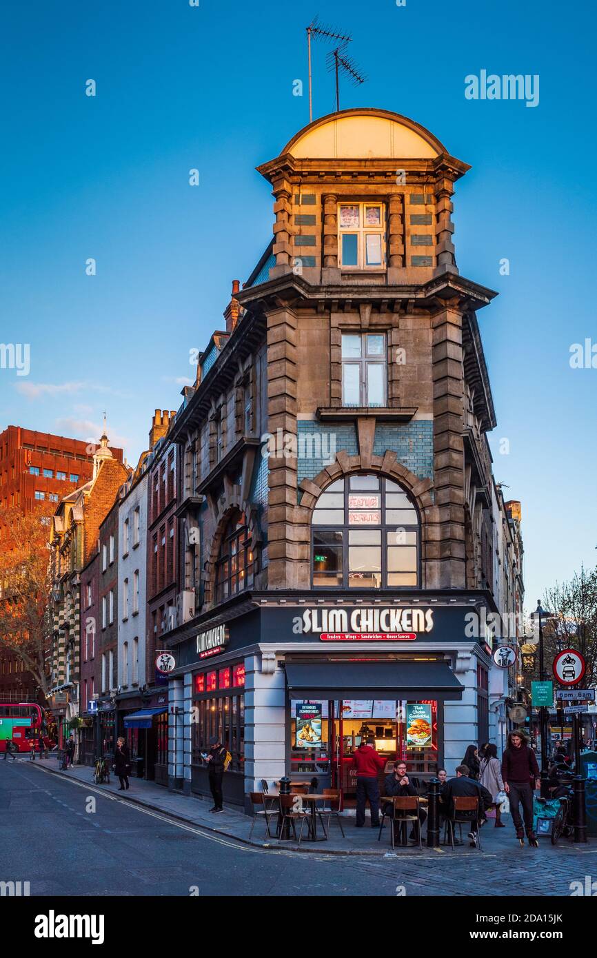 Old Compton Street Moor St Soho - Slim Chickens Restaurant in London - Slim Chickens is a US based fried chicken restaurant branching out in the UK. Stock Photo