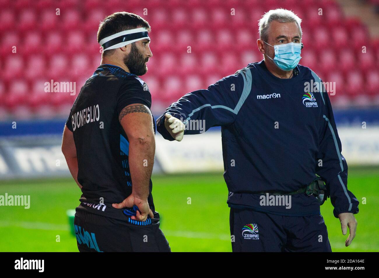 Llanelli, UK. 8 November, 2020. Zebre prop Paulo Buonfiglio talks to his medical team before pulling out of the Scarlets v Zebre PRO14 Rugby Match. Credit: Gruffydd Thomas/Alamy Live News Stock Photo