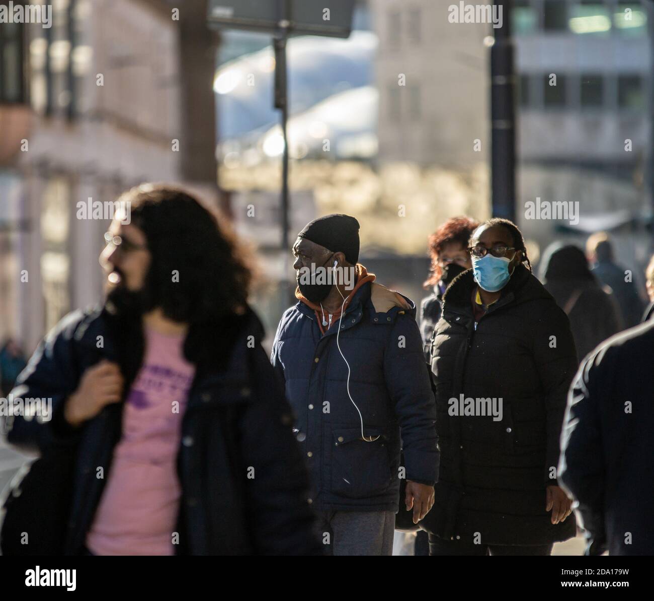 A couple amongst a crowd in Birmingham before the country dropped into an Autumn lockdown, November Stock Photo