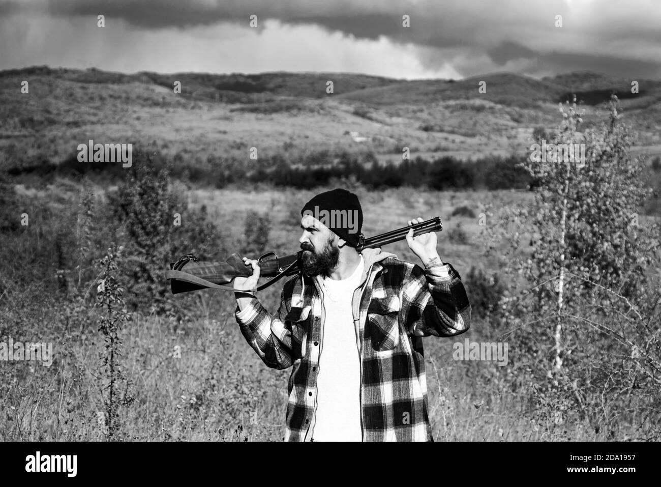 Hunter with shotgun gun on hunt. Autunm hunting. Closed and open