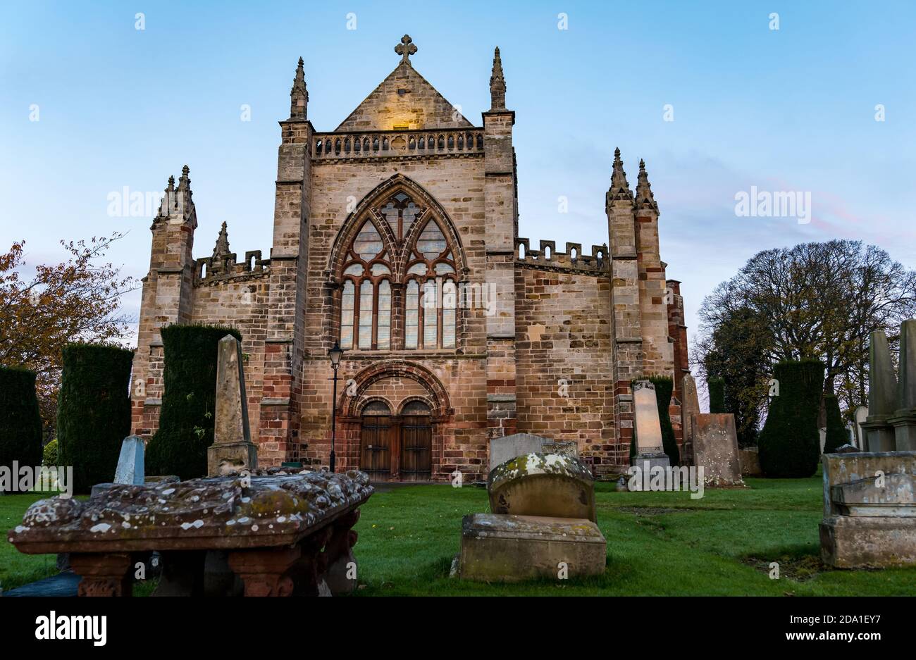 Graves at St Mary's Parish Church graveyard at dusk, Haddington, East Lothian, Scotland, UK Stock Photo