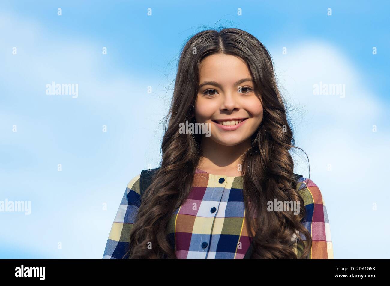 Share a new perfection. Happy child wear long wavy hairstyle outdoors. School look of little girl. Hair salon. Hairdressing education. Total haircare and scalp beauty solution Stock Photo - Alamy Share a new perfection. Happy child wear long wavy hairstyle outdoors. School look of little girl. Hair salon. Hairdressing education. Total haircare and scalp beauty solution Stock Photo - Alamy