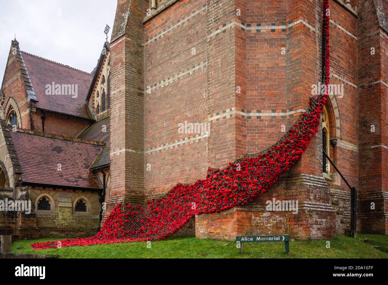 'Fall of Poppies for the Fallen' display of hand-knitted red poppies at Lyndhurst Church during Remembrance Sunday in November 2020, Lyndhurst, UK Stock Photo