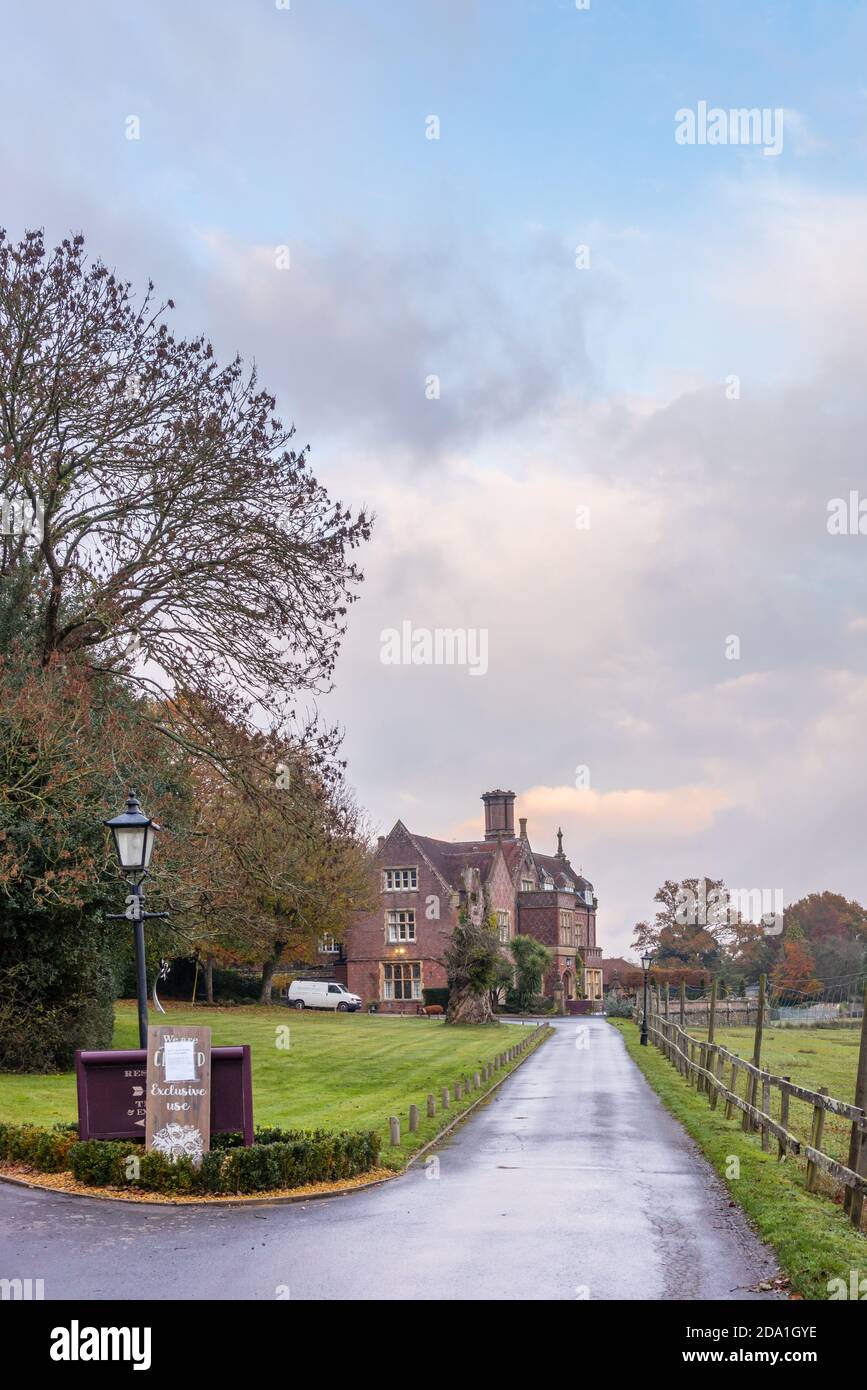 Road leading to Burley Manor during an autumnal evening, Burley Manor is a 4 star hotel and restaurant in the New Forest, Hampshire, England, UK Stock Photo