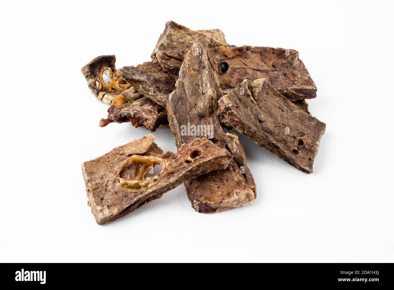 dried tendons of beef, lamb, pork, deer dog treats on white background