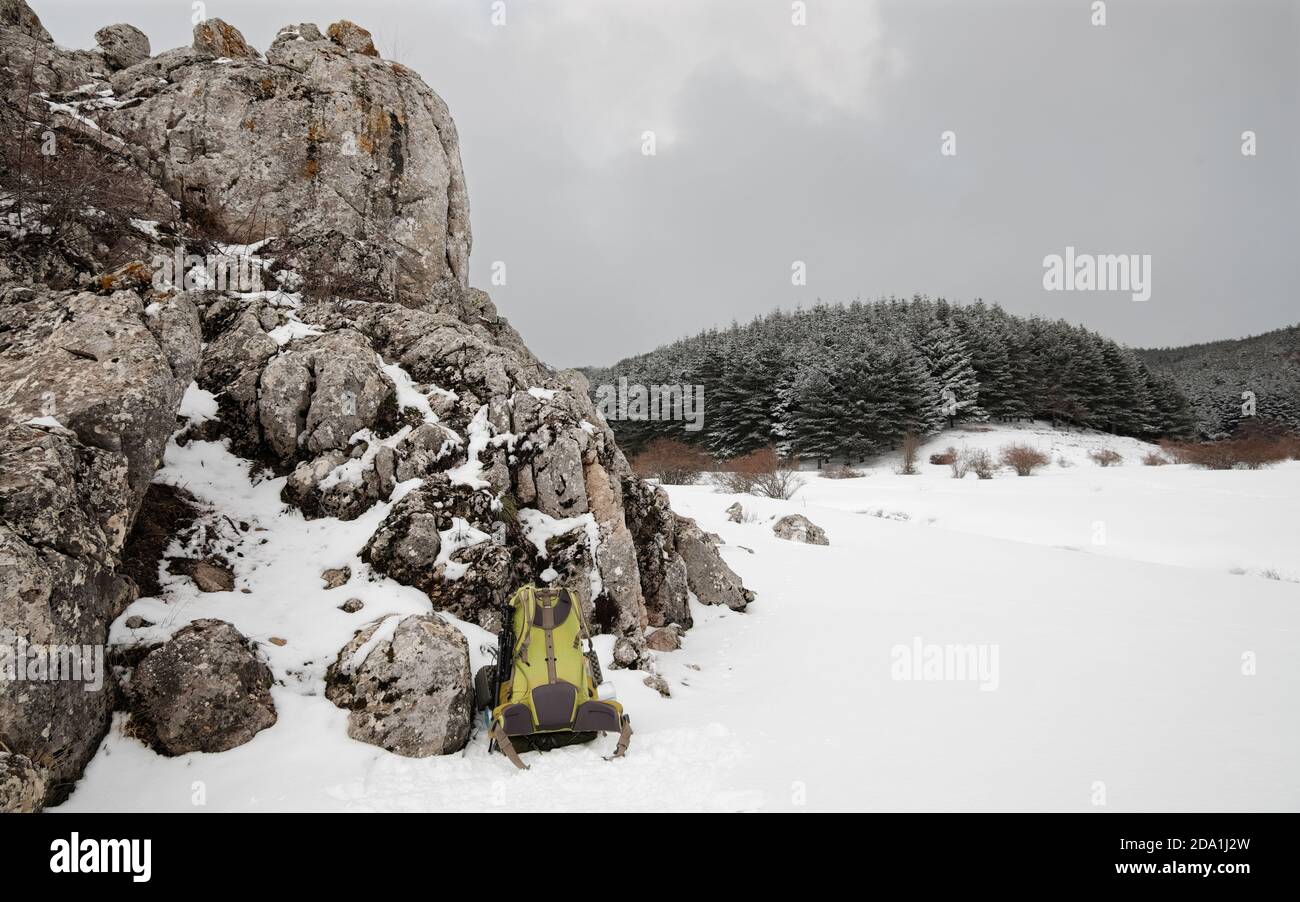 winter landscape with green backpack in Nebrodi Park, Sicily Stock Photo