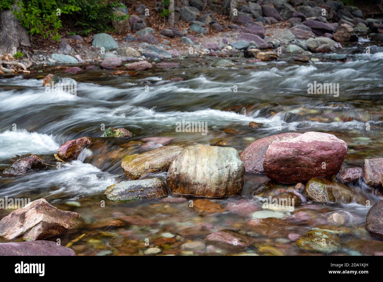 Colorful rocks in a creek in Montana Stock Photo