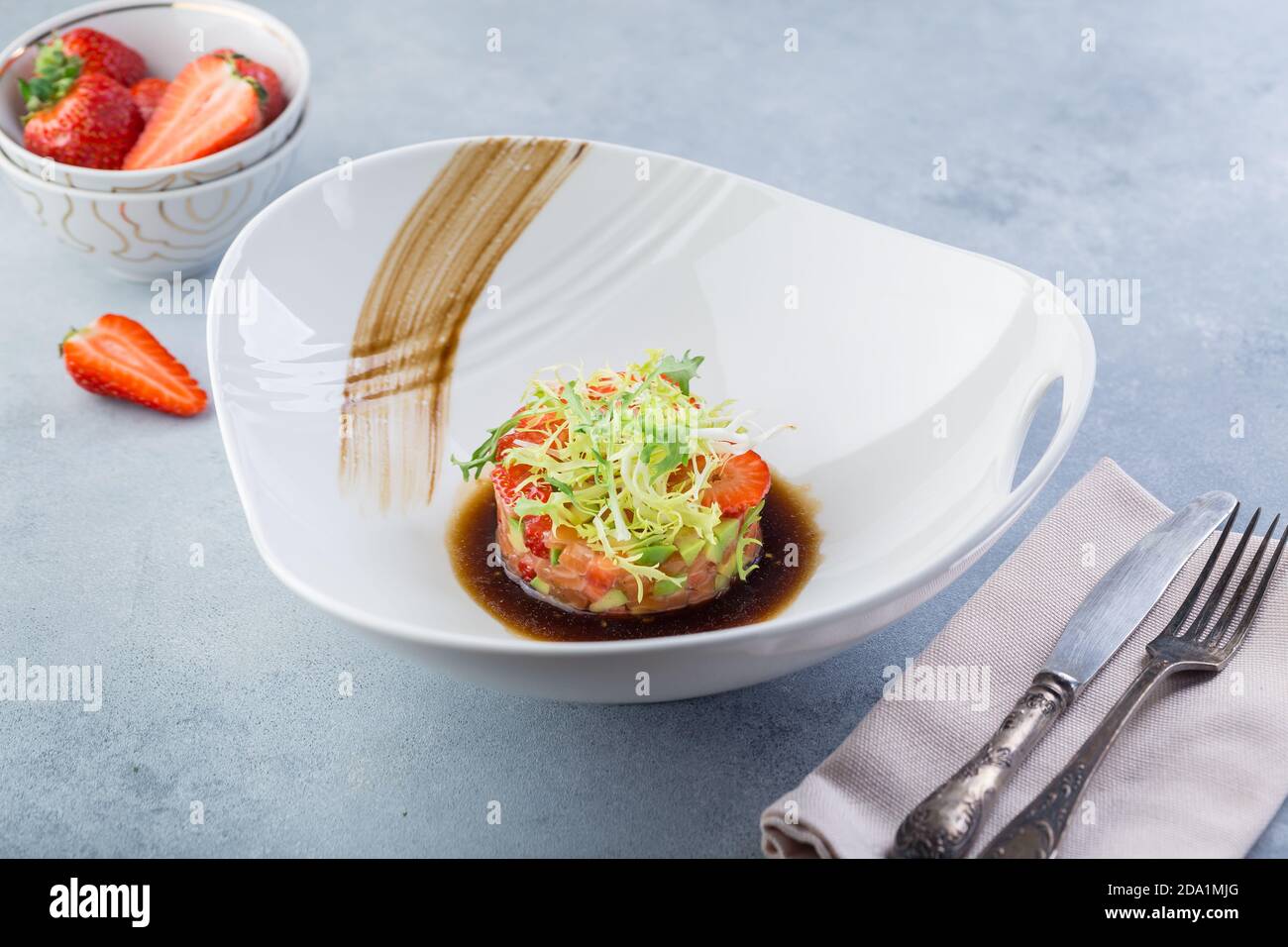 Ready made raw fish tartare from the chef. Original presentation Stock